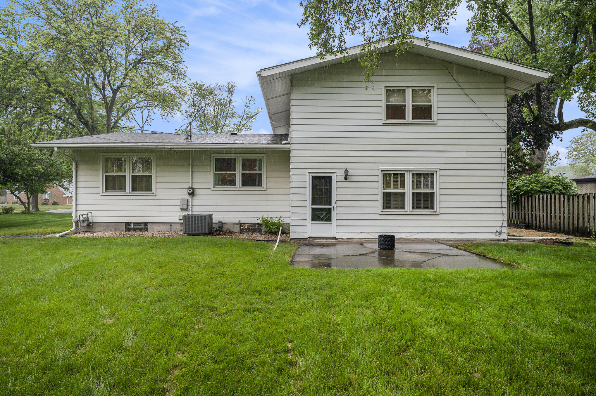 9307 Walnut Drive Munster, IN 46321 - Photo 23 of 26 a backyard of a house with table and chairs