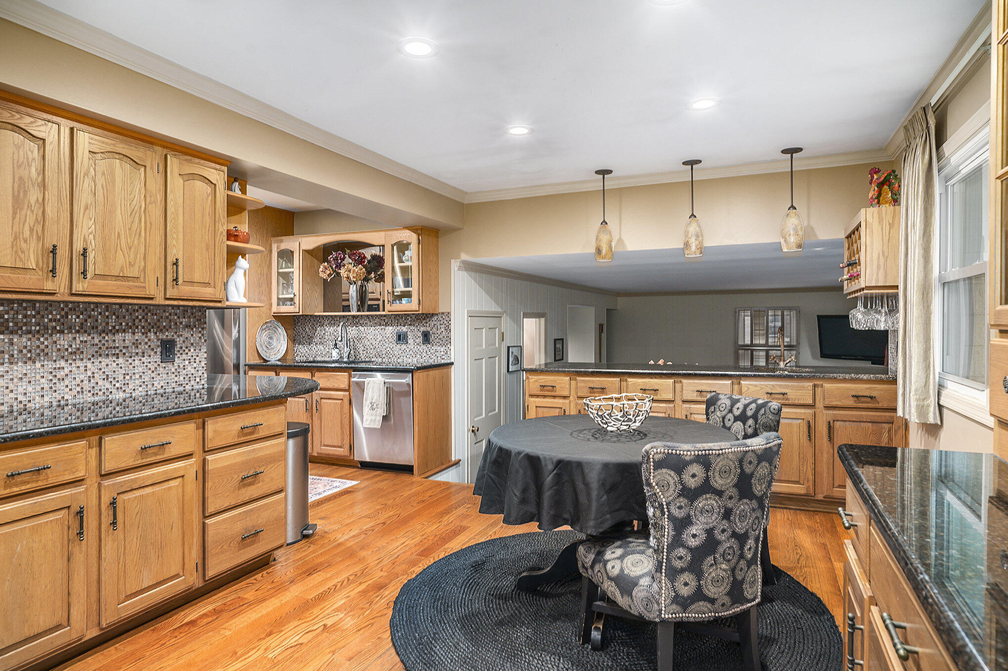 9307 Walnut Drive Munster, IN 46321 - Photo 8 of 26 a kitchen with stainless steel appliances granite countertop a sink and cabinets