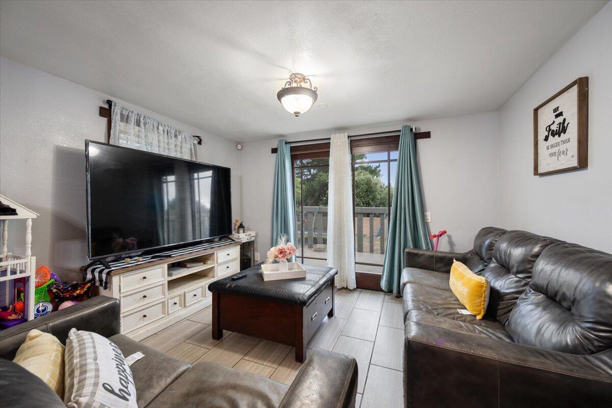524 Avalon Street Lompoc, CA 93436 - Photo 12 of 36 a living room with furniture and a flat screen tv