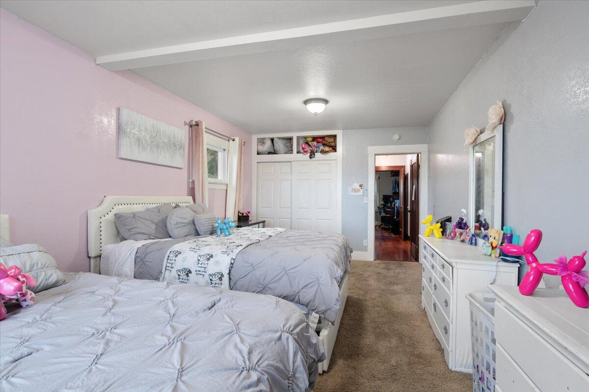 524 Avalon Street Lompoc, CA 93436 - Photo 24 of 36 a soft toy sitting on a bed in a room