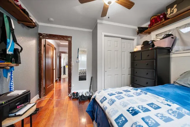 a bedroom with a bed and a dresser