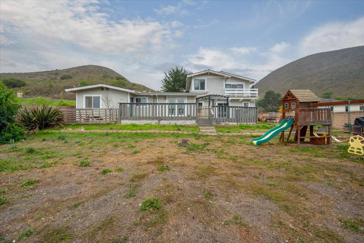 524 Avalon Street Lompoc, CA 93436 - Photo 33 of 36 a view of a house with a yard and a large tree