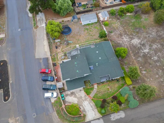 an aerial view of house with yard