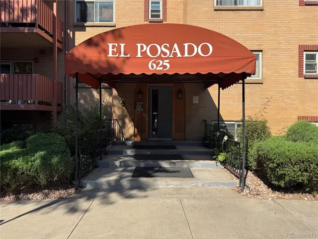 a front view of a retail shop with an outdoor seating
