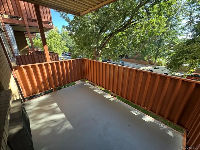 a view of balcony with wooden floor