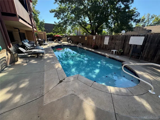 a view of a backyard with sitting area
