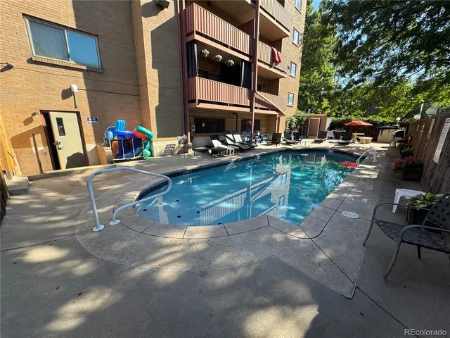a view of a patio with table and chairs and potted plants