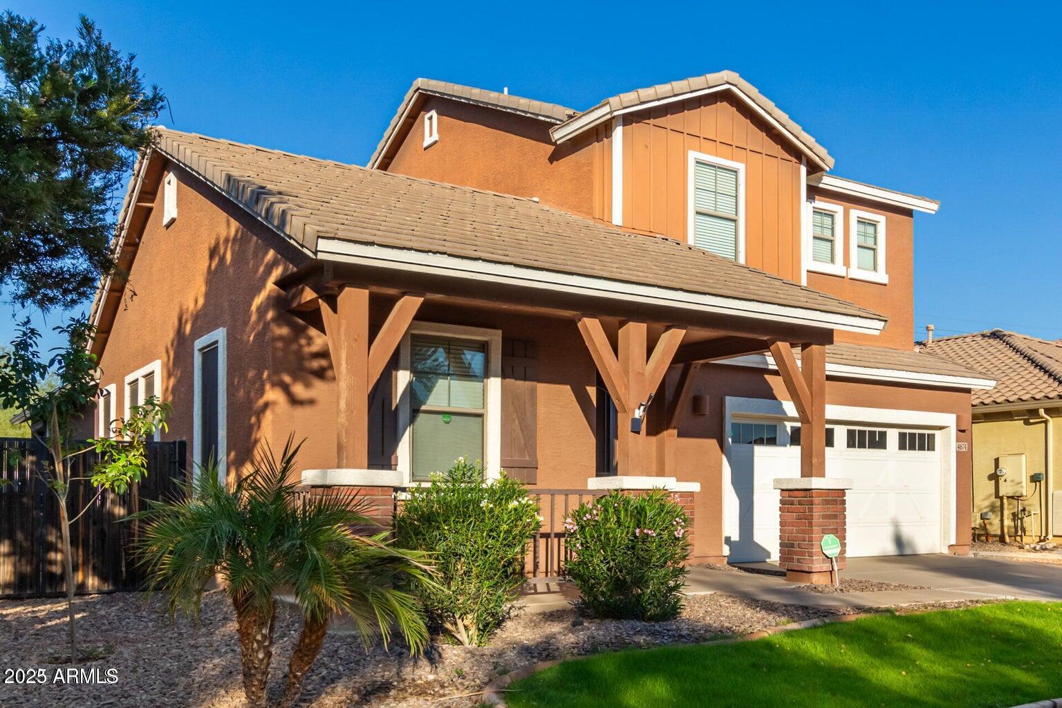 4674 South Twinleaf Drive Gilbert, AZ 85297 - Photo 1 of 18 a front view of a house with garden