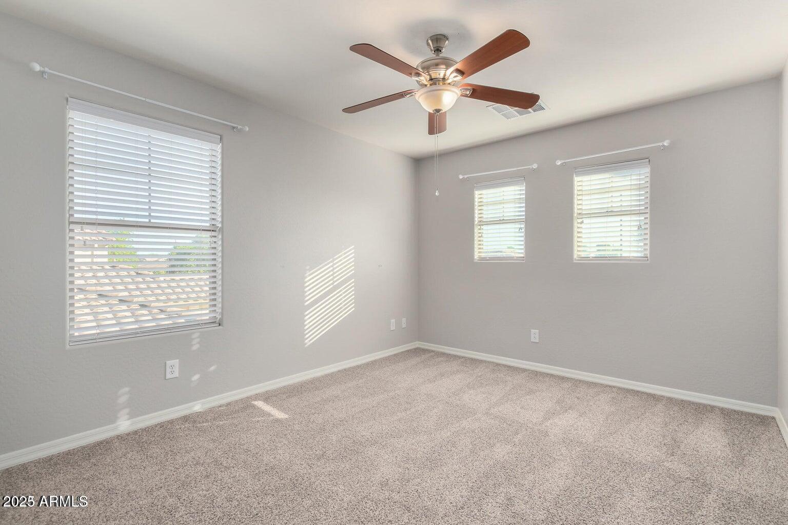4674 South Twinleaf Drive Gilbert, AZ 85297 - Photo 12 of 18 a view of an empty room with a window