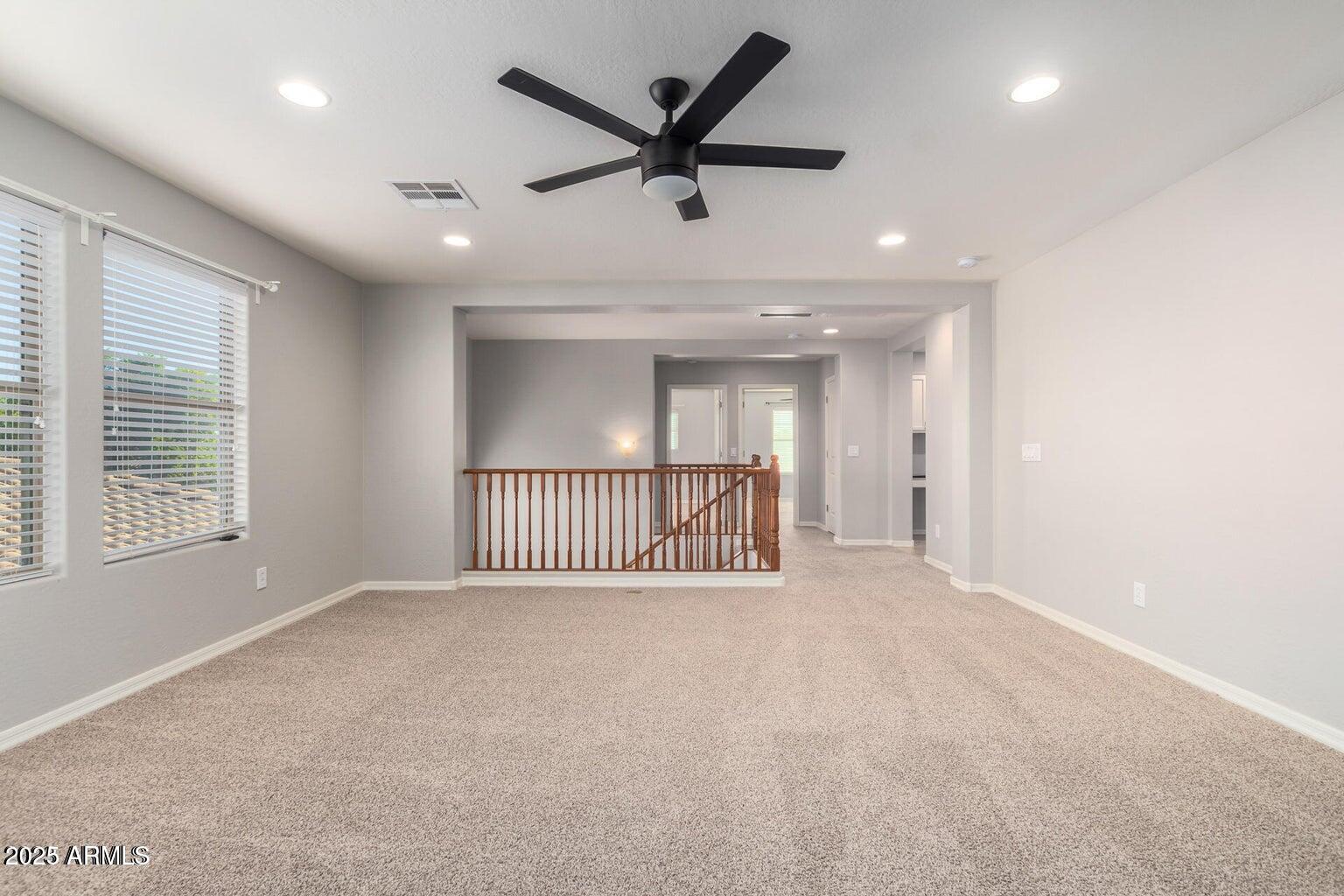 4674 South Twinleaf Drive Gilbert, AZ 85297 - Photo 13 of 18 a view of a livingroom with a ceiling fan and window