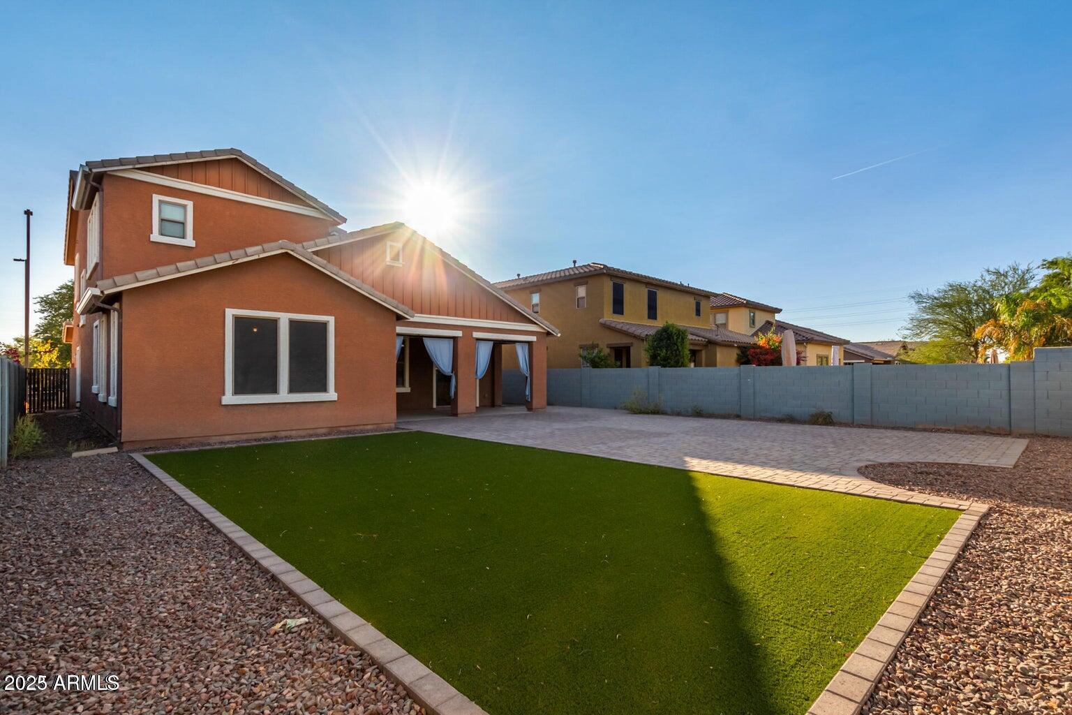 4674 South Twinleaf Drive Gilbert, AZ 85297 - Photo 17 of 18 a view of a house with pool and a yard