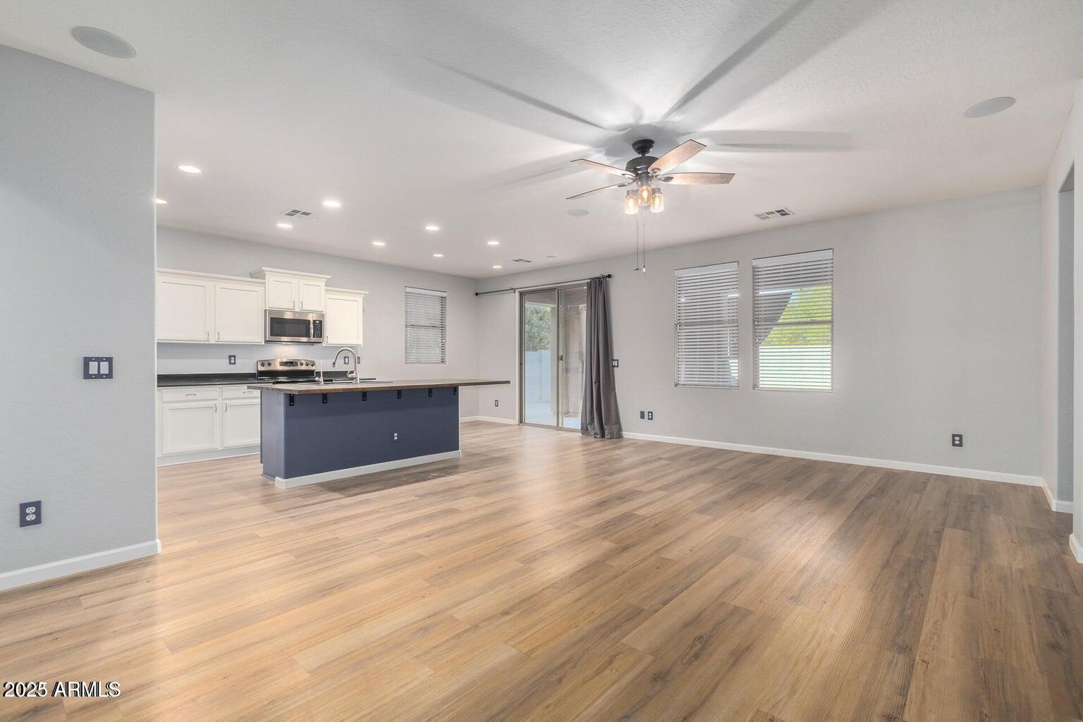 4674 South Twinleaf Drive Gilbert, AZ 85297 - Photo 5 of 18 a view of kitchen with stove and cabinets