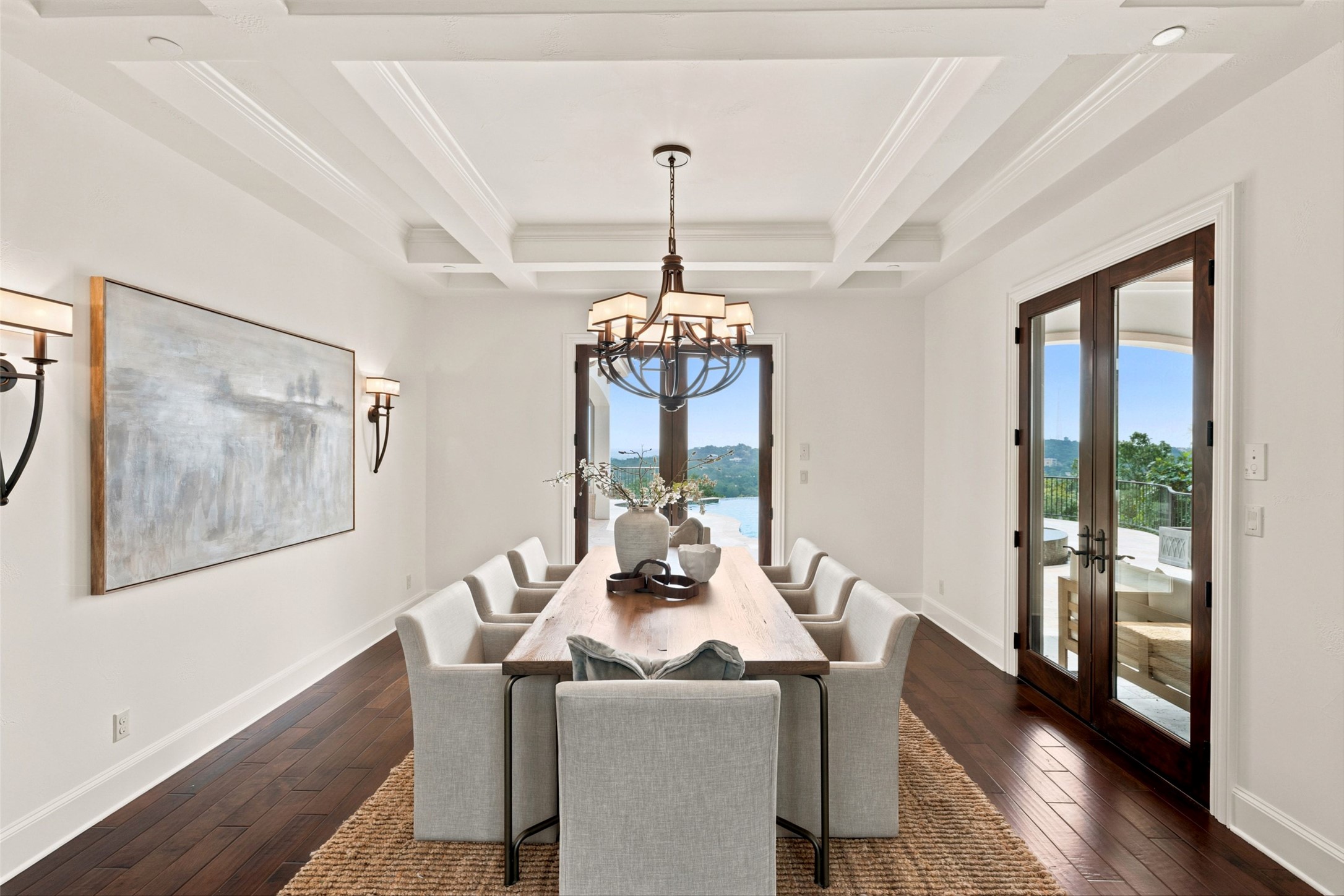1414 The High Road Austin, TX 78746 - Photo 15 of 40 Hardwood floors and coffered ceilings define this formal dining room, opening to a scenic outdoor patio.
