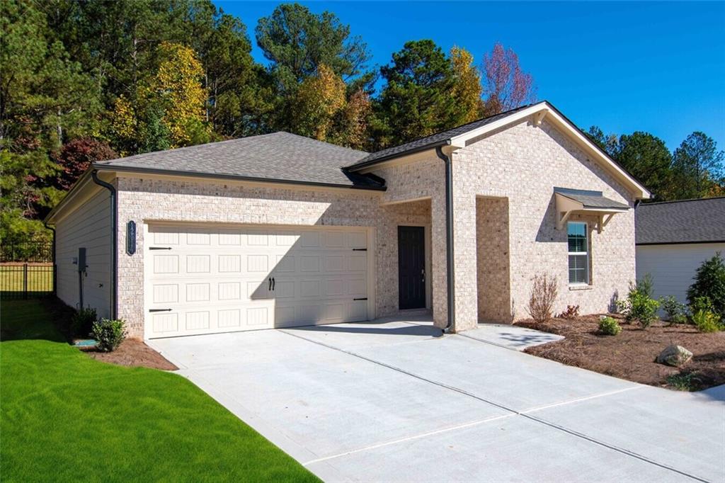 a view of a house with a yard