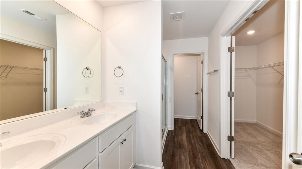 12006 Crosswicks Road, Unit SUNBURST Union City, GA 30291 - Photo 16 of 24 a bathroom with a sink and a mirror