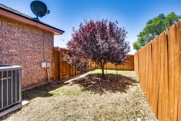 a view of a backyard of the house