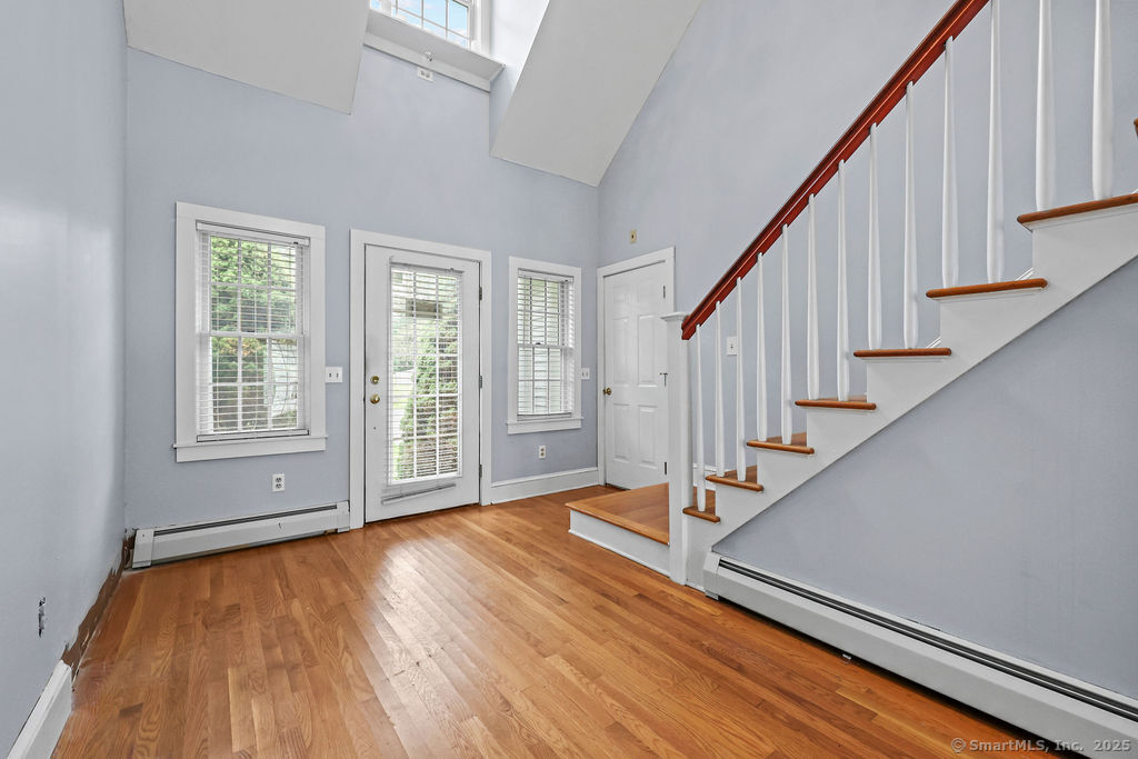 88 Powder Hill Road Middlefield, CT 06455 - Photo 11 of 40 a view of an empty room with wooden floor and fan
