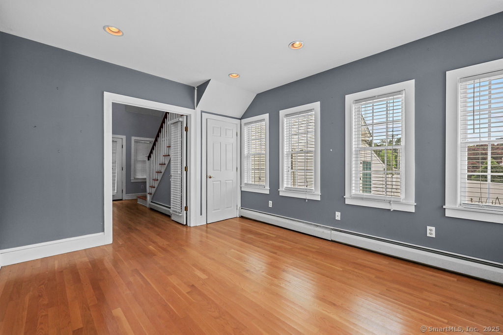 88 Powder Hill Road Middlefield, CT 06455 - Photo 14 of 40 a view of an empty room with glass door and wooden floor