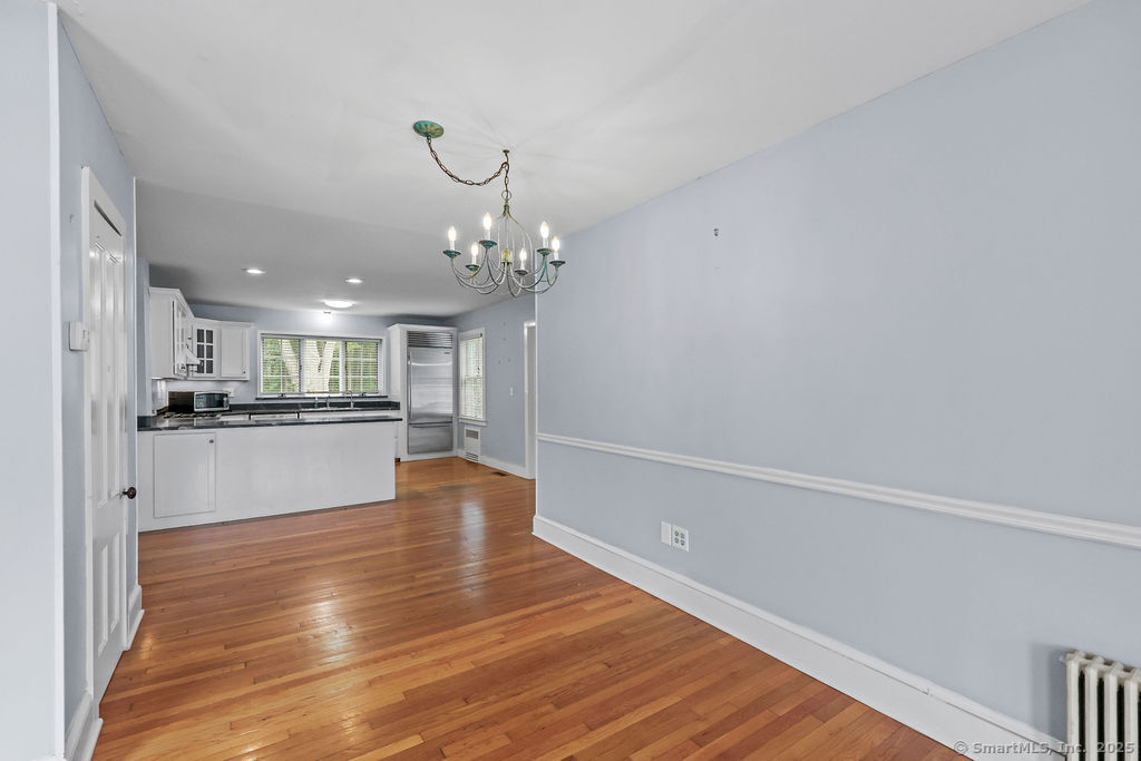 88 Powder Hill Road Middlefield, CT 06455 - Photo 19 of 40 a view of kitchen with cabinets and wooden floor
