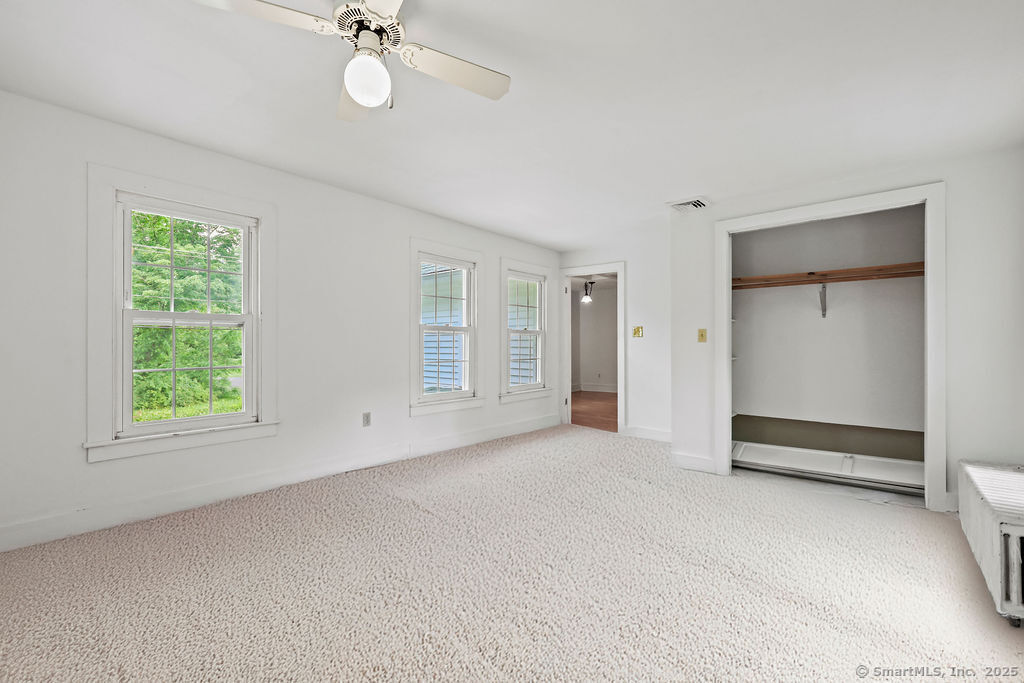 88 Powder Hill Road Middlefield, CT 06455 - Photo 22 of 40 an empty room with a empty space and windows