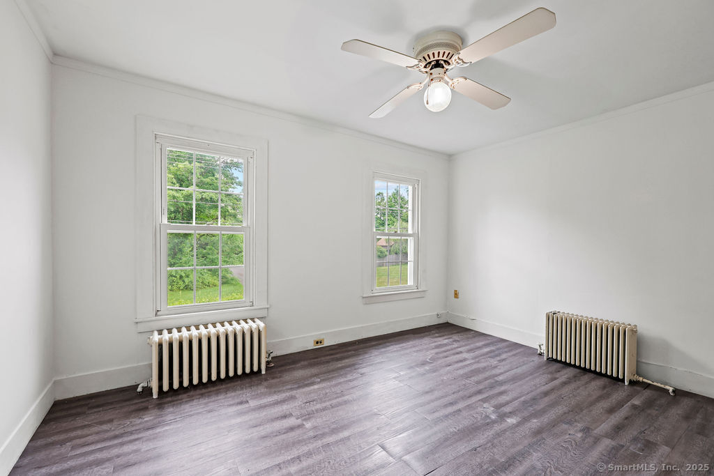 88 Powder Hill Road Middlefield, CT 06455 - Photo 25 of 40 a view of an empty room with wooden floor and a window