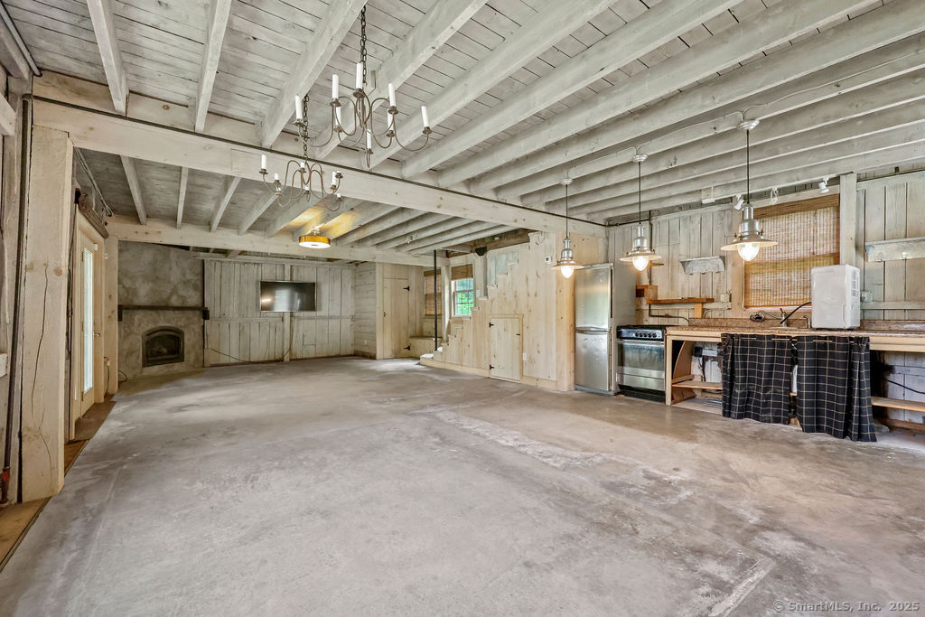 88 Powder Hill Road Middlefield, CT 06455 - Photo 26 of 40 a view of an empty room with a fireplace