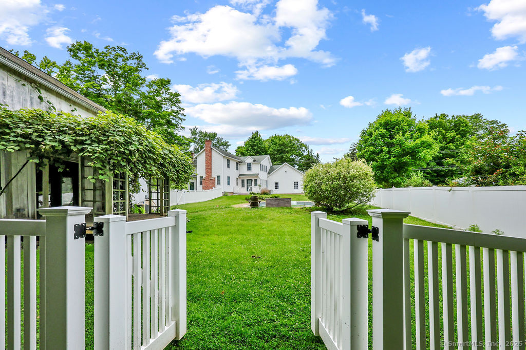 88 Powder Hill Road Middlefield, CT 06455 - Photo 6 of 40 a view of a house with backyard from a garden