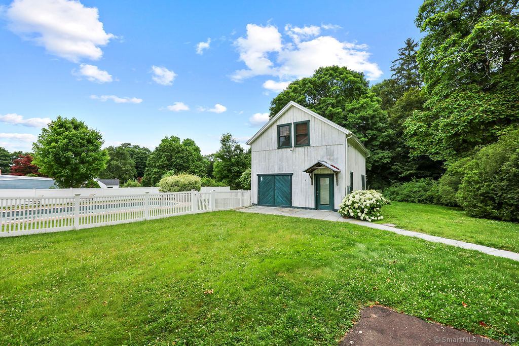 88 Powder Hill Road Middlefield, CT 06455 - Photo 8 of 40 a view of a house with a yard and a garden