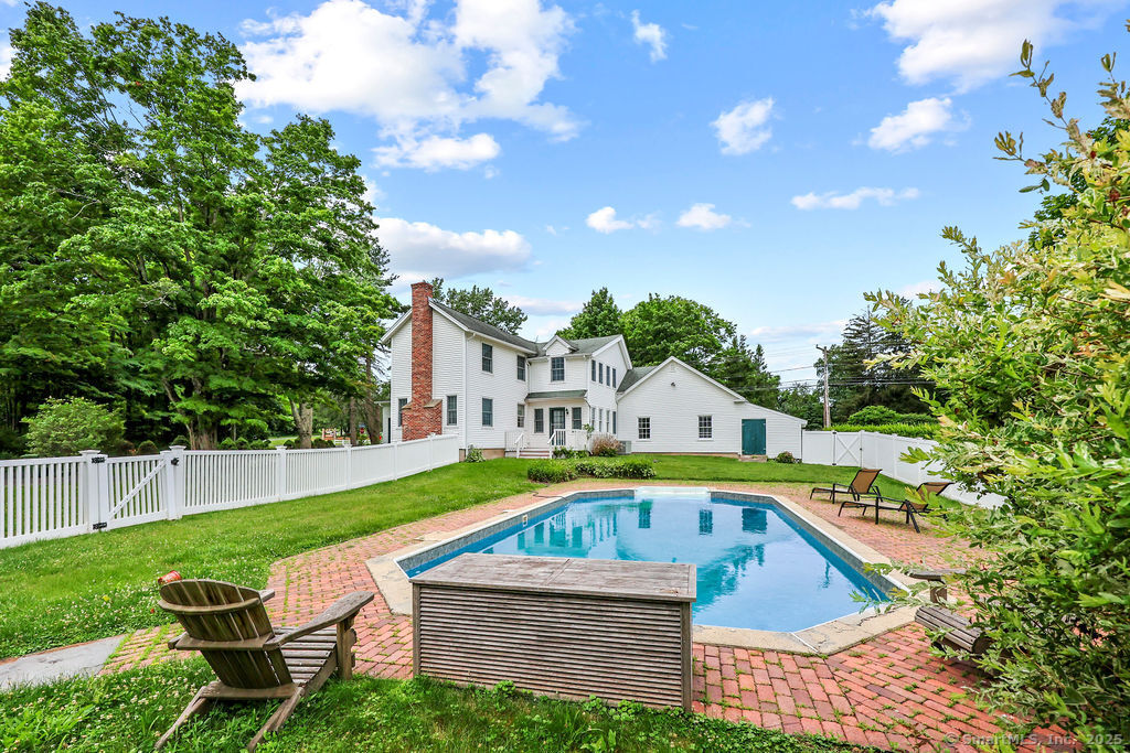 88 Powder Hill Road Middlefield, CT 06455 - Photo 9 of 40 a view of backyard with swimming pool and outdoor seating