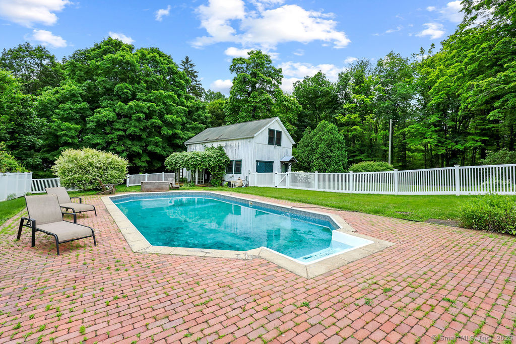 88 Powder Hill Road Middlefield, CT 06455 - Photo 10 of 40 a view of a house with a swimming pool