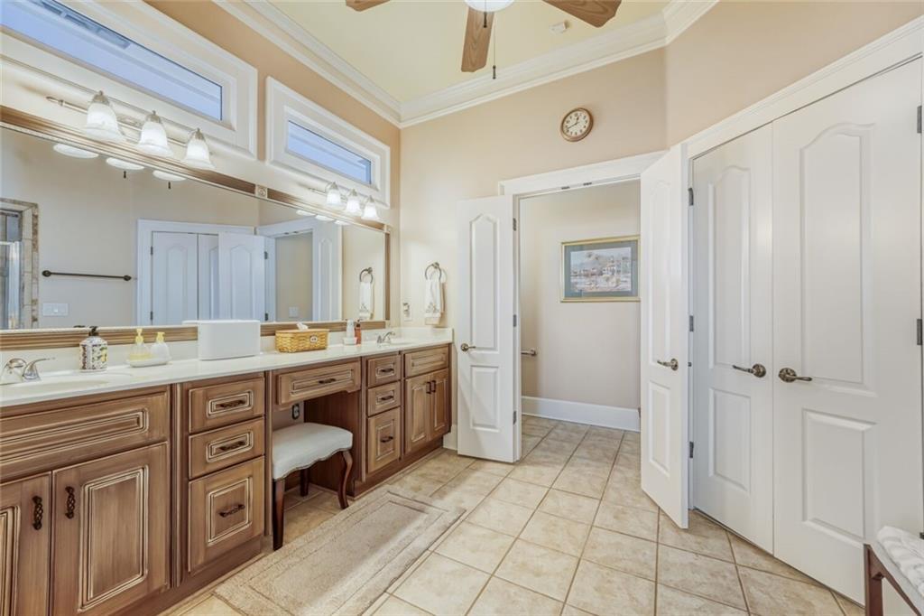 2380 Muskogee Lane Braselton, GA 30517 - Photo 24 of 30 a spacious bathroom with a granite countertop sink mirror and a bathtub
