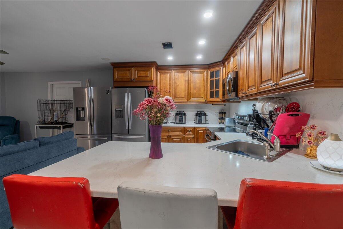 430 80th Street Marathon, FL 33050 - Photo 12 of 44 a kitchen with stainless steel appliances granite countertop a sink and cabinets
