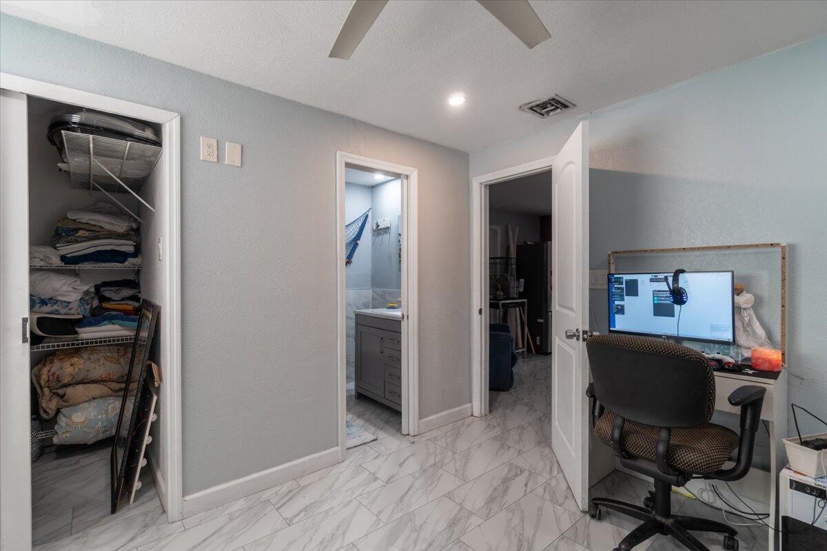 430 80th Street Marathon, FL 33050 - Photo 15 of 44 a workspace with wooden floor and furniture