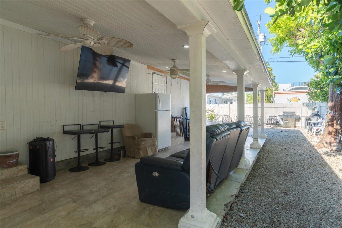 430 80th Street Marathon, FL 33050 - Photo 2 of 44 a living room with furniture and a floor to ceiling window