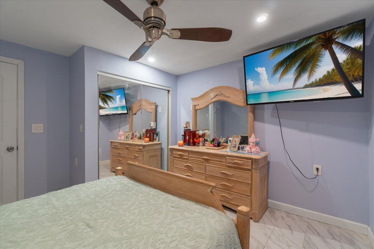 430 80th Street Marathon, FL 33050 - Photo 21 of 44 a bedroom with a bed and a dresser