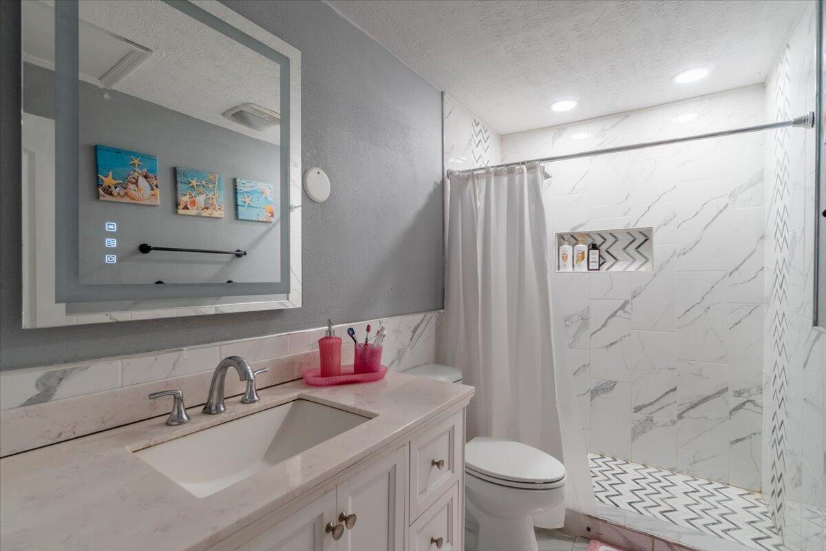 430 80th Street Marathon, FL 33050 - Photo 22 of 44 a bathroom with a sink toilet and shower