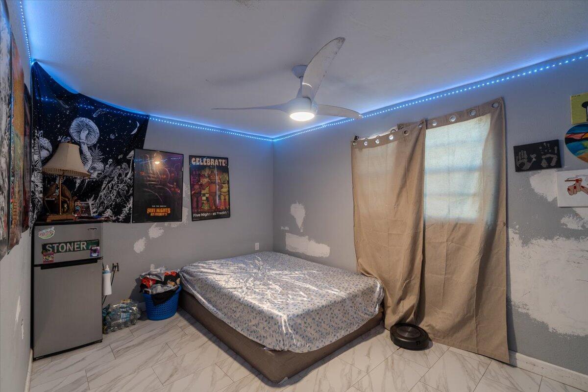 430 80th Street Marathon, FL 33050 - Photo 24 of 44 a bedroom with a bed and a window