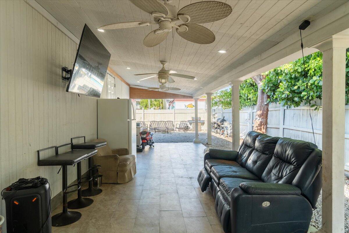 430 80th Street Marathon, FL 33050 - Photo 3 of 44 a living room with patio furniture and a chandelier