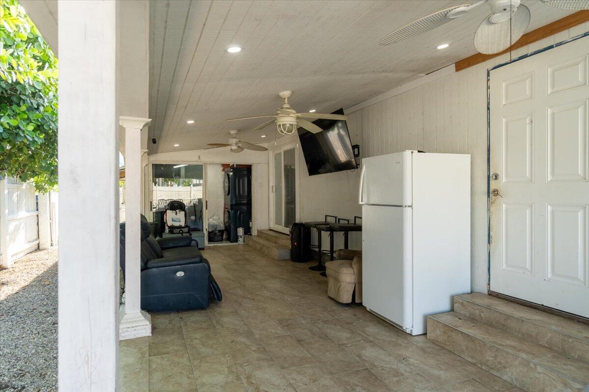 430 80th Street Marathon, FL 33050 - Photo 4 of 44 a bed room with furniture and a refrigerator