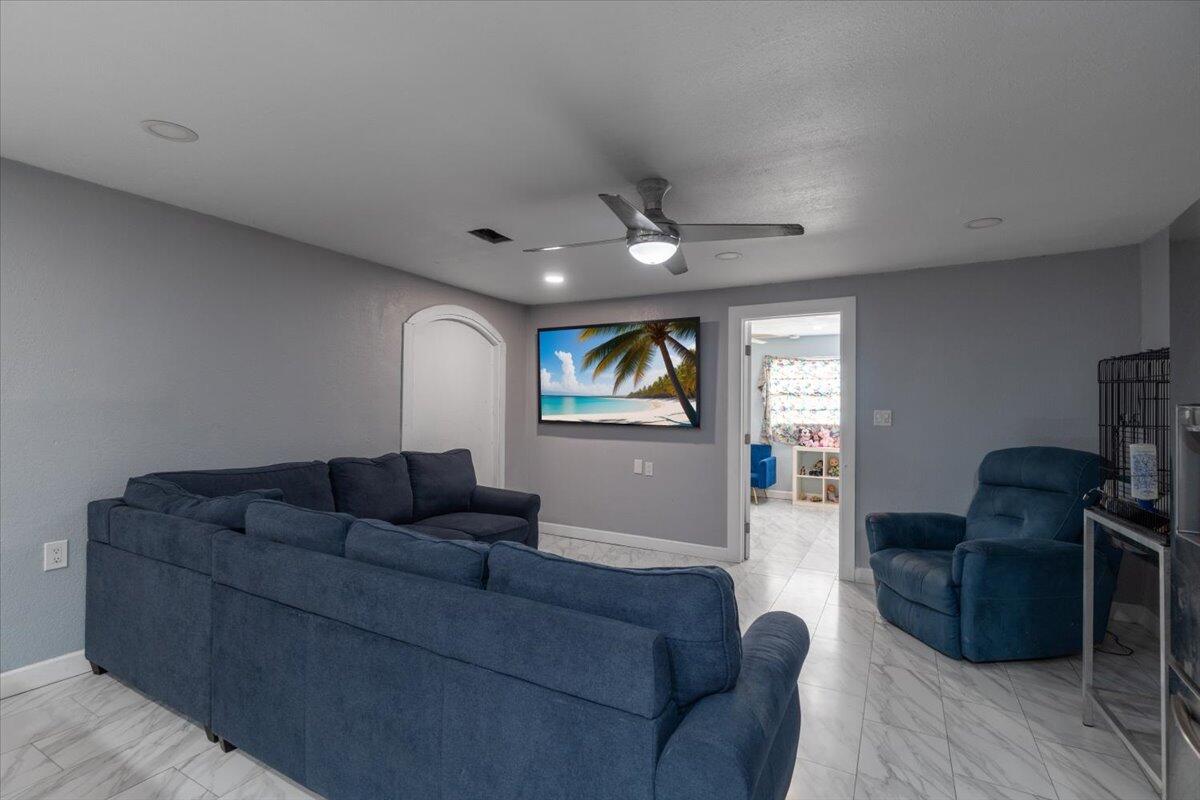 430 80th Street Marathon, FL 33050 - Photo 6 of 44 a living room with furniture and a flat screen tv