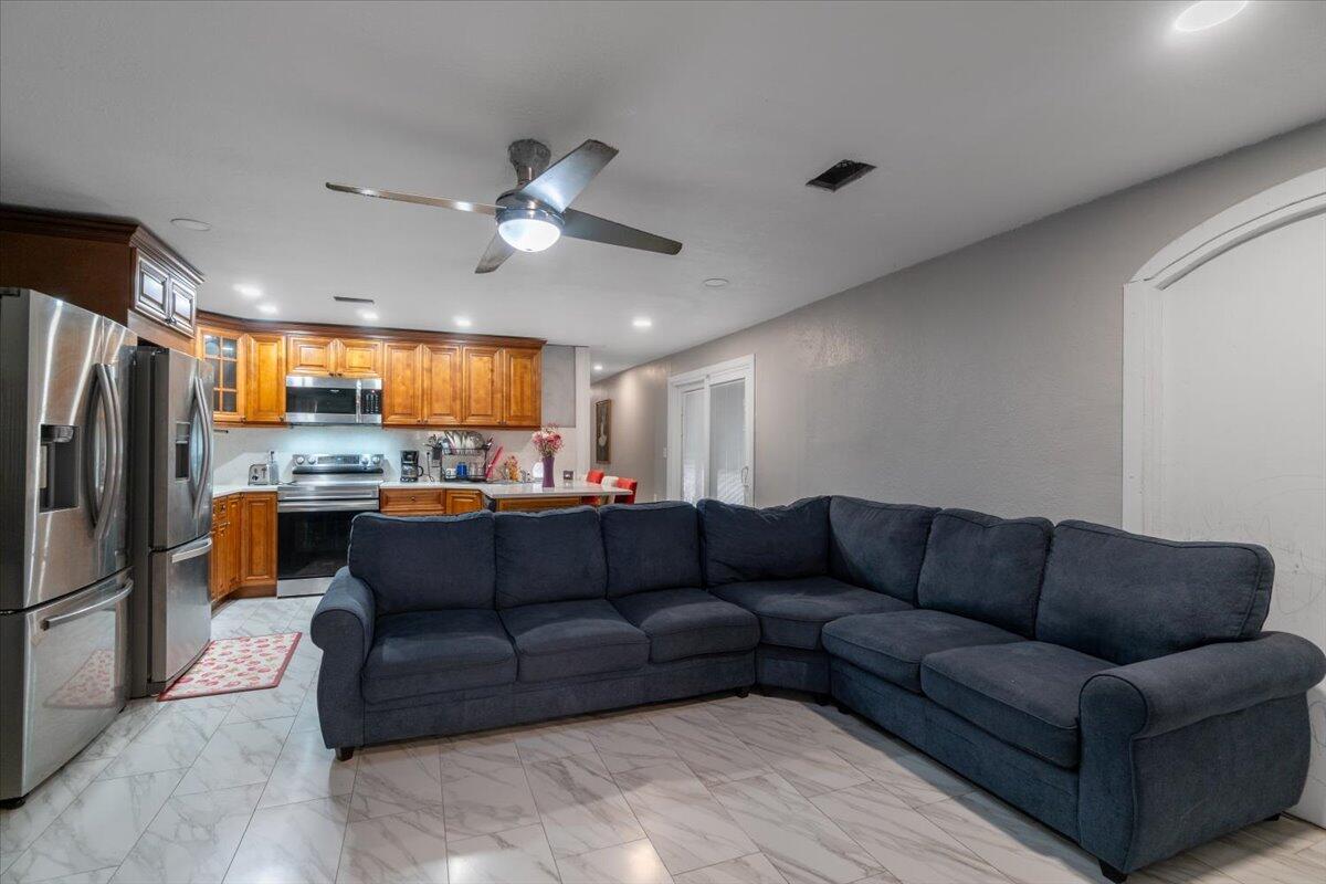 430 80th Street Marathon, FL 33050 - Photo 7 of 44 a living room with a couch and a ceiling fan