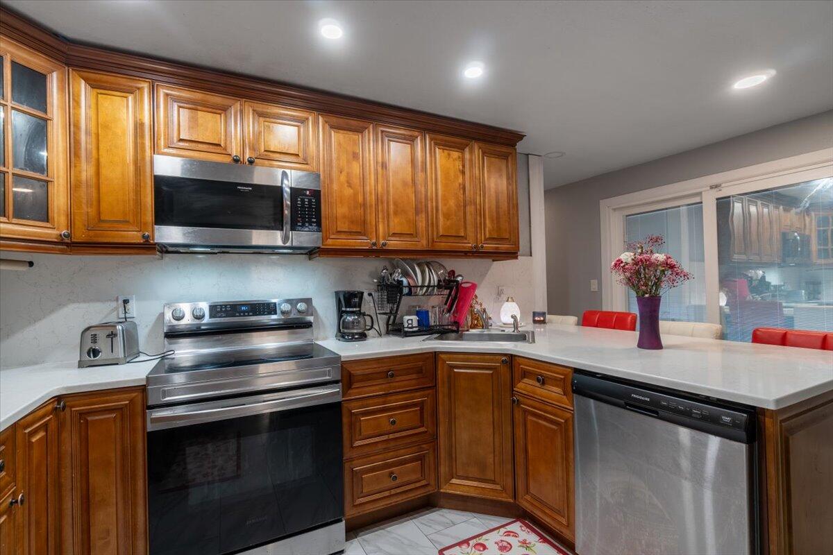430 80th Street Marathon, FL 33050 - Photo 10 of 44 a kitchen with a stove a sink and a microwave