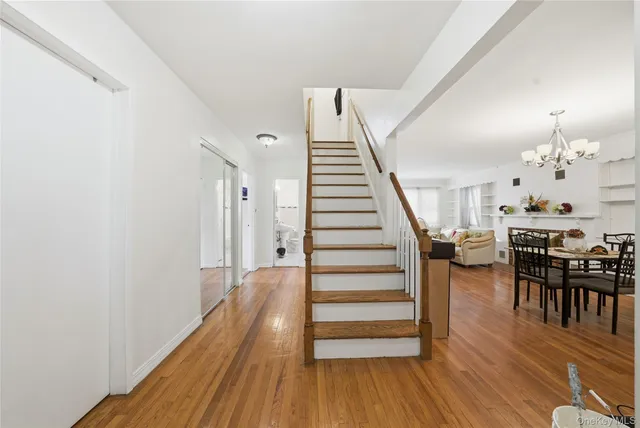a view of a room with wooden floor and stairs