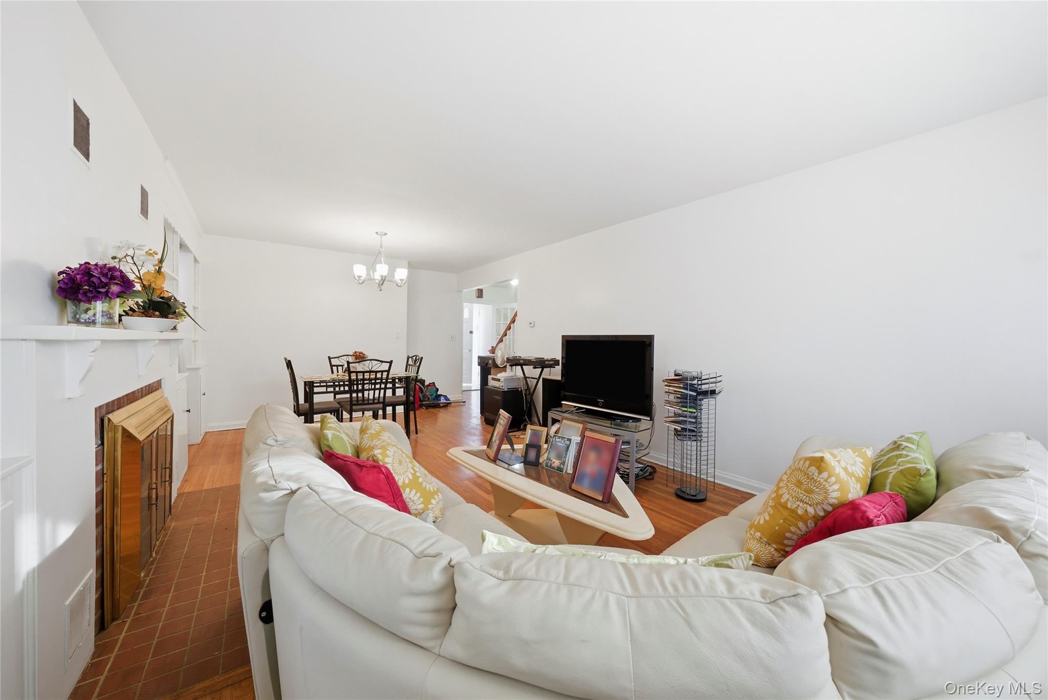 4161 Monticello Avenue Bronx, NY 10466 - Photo 21 of 38 a living room with furniture and a flat screen tv
