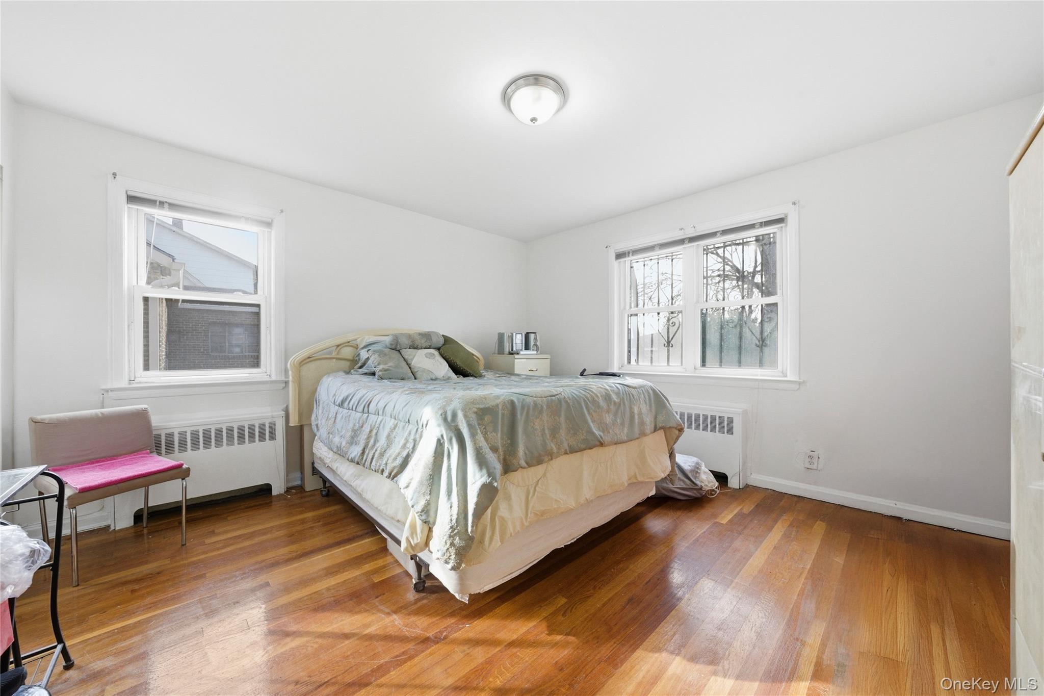 4161 Monticello Avenue Bronx, NY 10466 - Photo 23 of 38 a bedroom with a bed and wooden floor