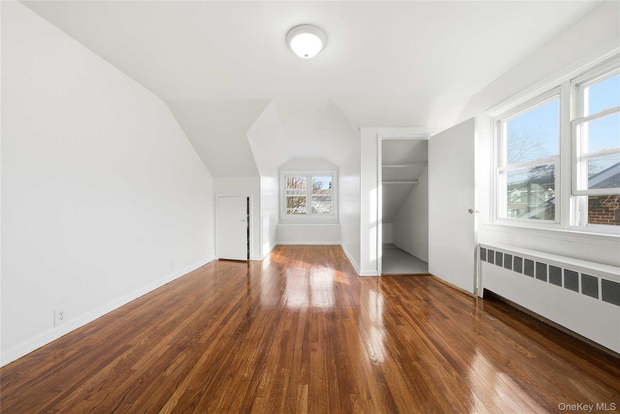4161 Monticello Avenue Bronx, NY 10466 - Photo 27 of 38 wooden floor in an empty room with a window