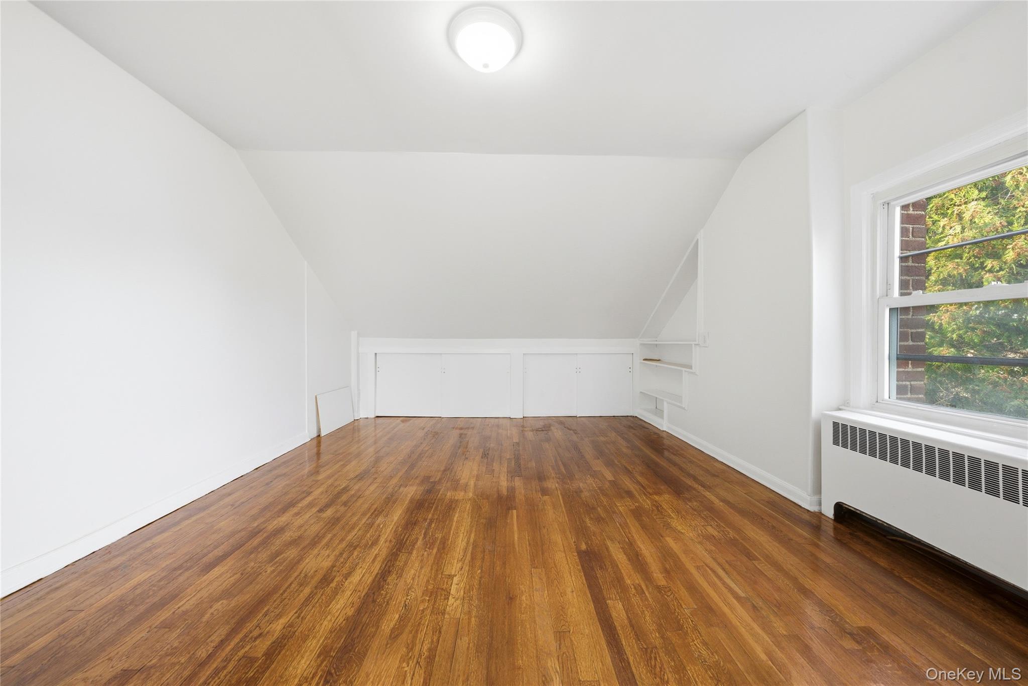 4161 Monticello Avenue Bronx, NY 10466 - Photo 29 of 38 a view of empty room with wooden floor and fan