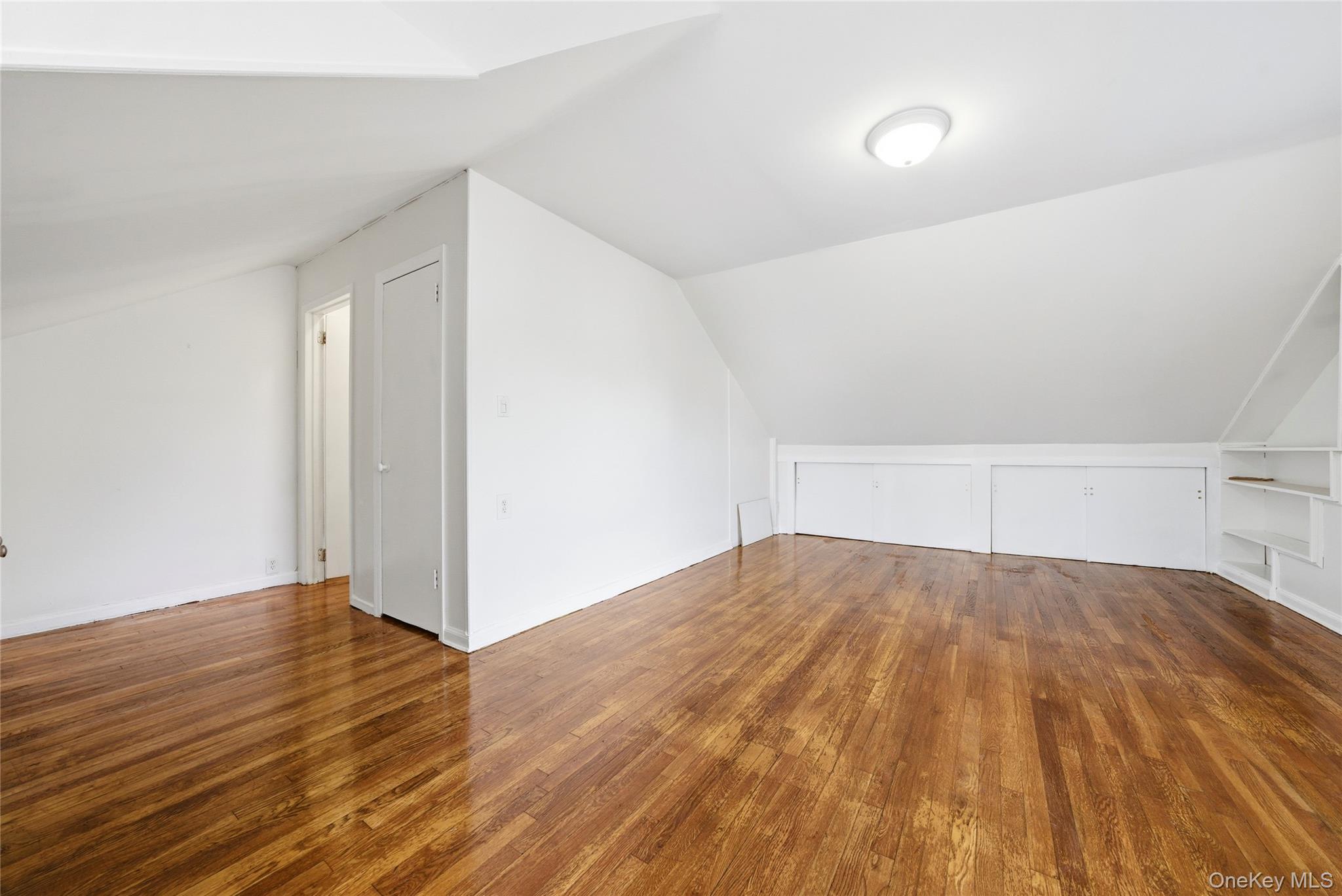 4161 Monticello Avenue Bronx, NY 10466 - Photo 30 of 38 a view of empty room with wooden floor