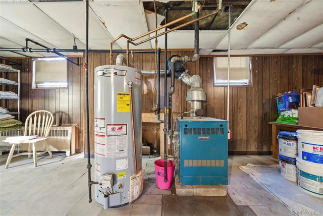 a bathroom with a sink mirror and shower