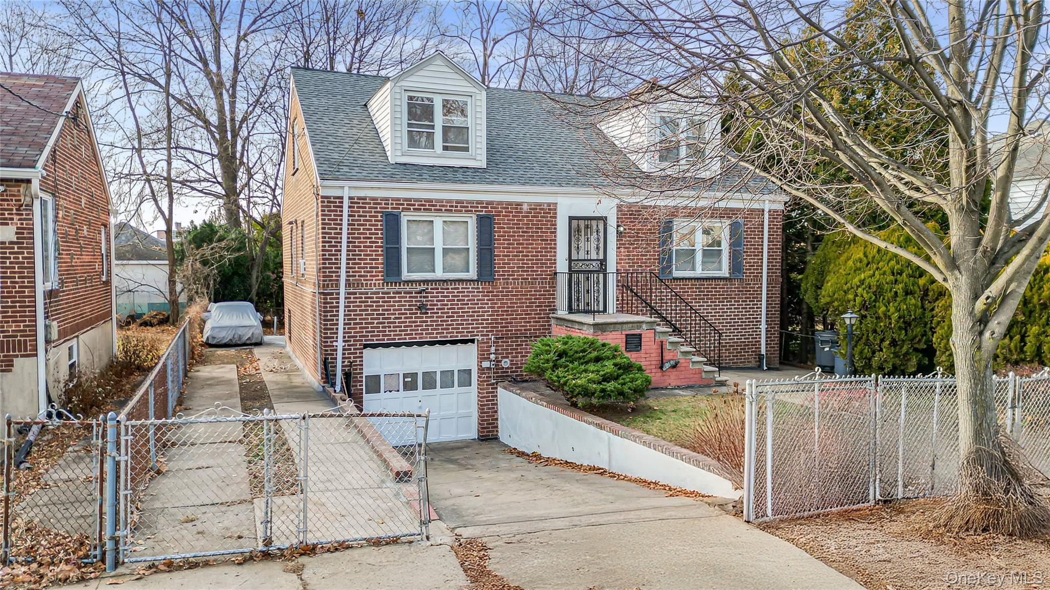 4161 Monticello Avenue Bronx, NY 10466 - Photo 5 of 38 a front view of a house with a garden